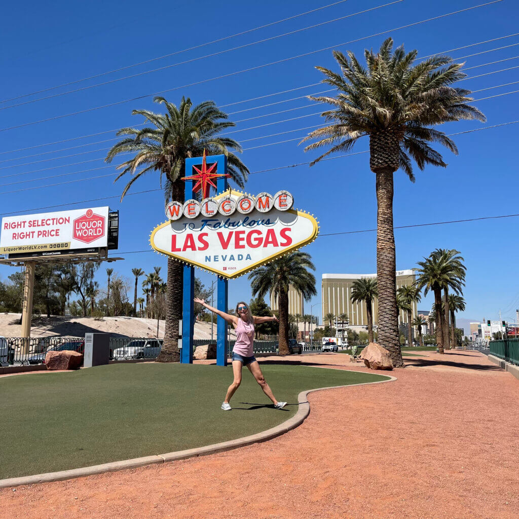 SightseeingSally throws open her arms to Las Vegas in front of the city's welcome sign.